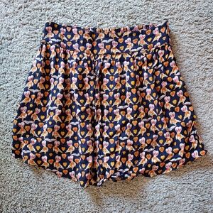 Urban Outfitters foxes reading books print mini skirt